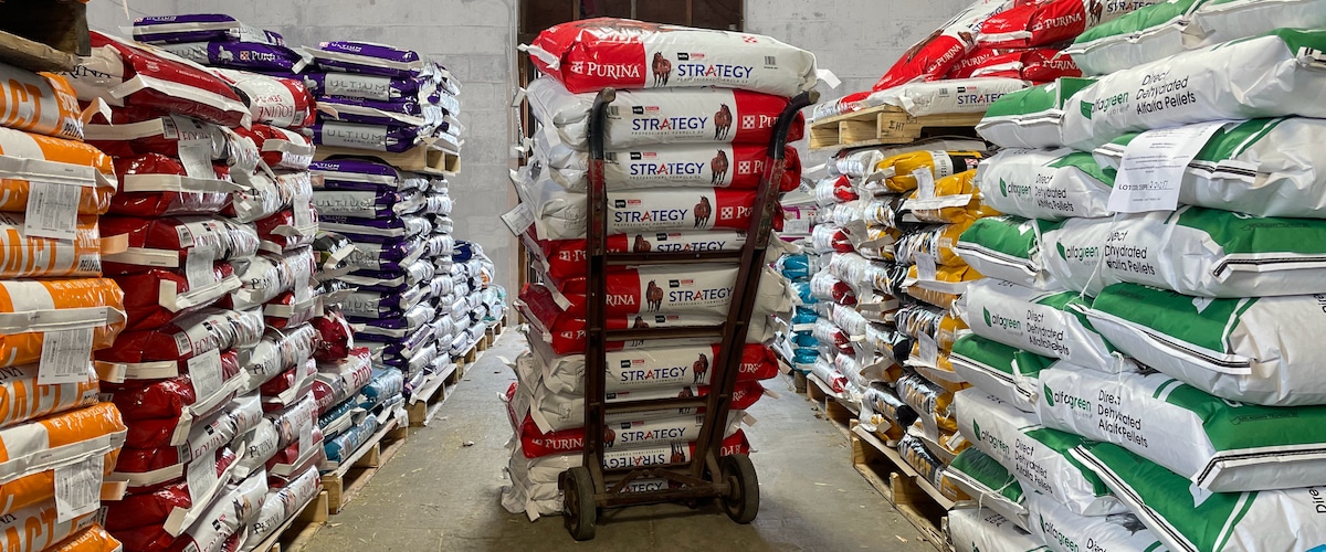 Bags of horse feed stacked at our store